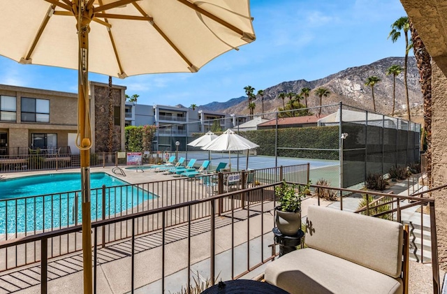 view of swimming pool featuring a mountain view