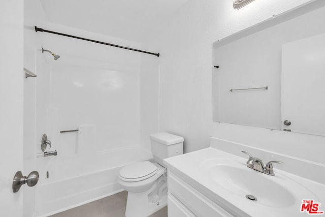 full bathroom with bathing tub / shower combination, tile patterned flooring, vanity, and toilet