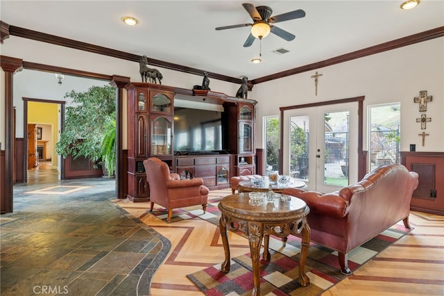 sitting room with ceiling fan, french doors, and ornamental molding