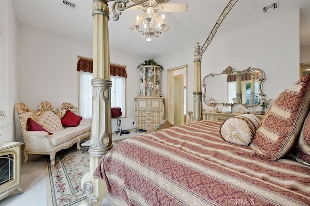 bedroom featuring light tile patterned floors and decorative columns