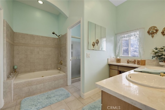 bathroom featuring vanity, shower with separate bathtub, and tile patterned floors