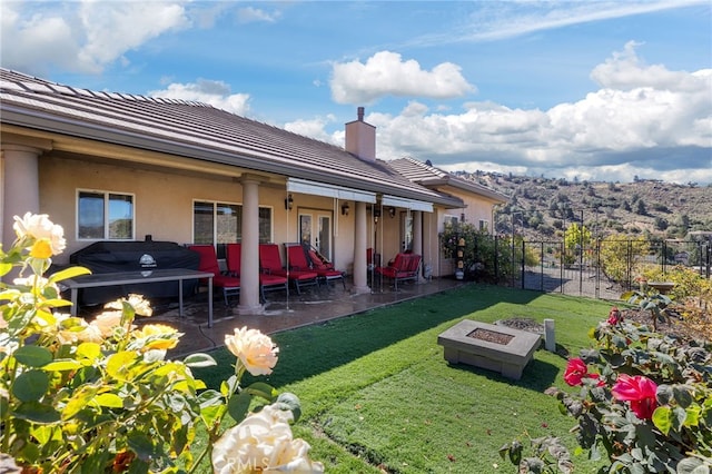 view of yard with a patio area and a fire pit