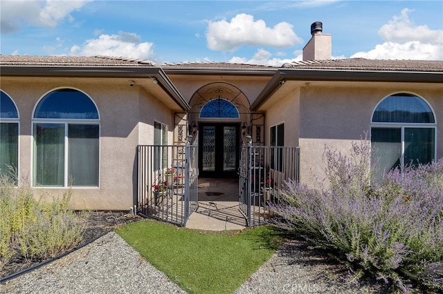 doorway to property featuring french doors