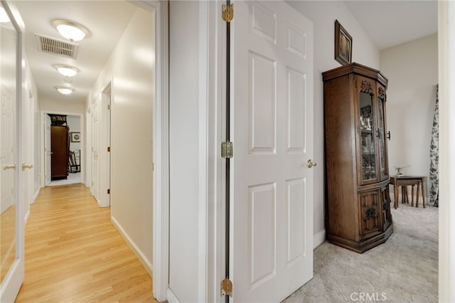 hall with light hardwood / wood-style flooring