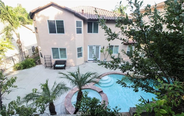 rear view of house featuring a patio