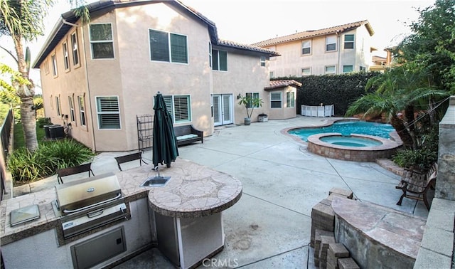 exterior space featuring a pool with hot tub, area for grilling, central AC unit, and a grill