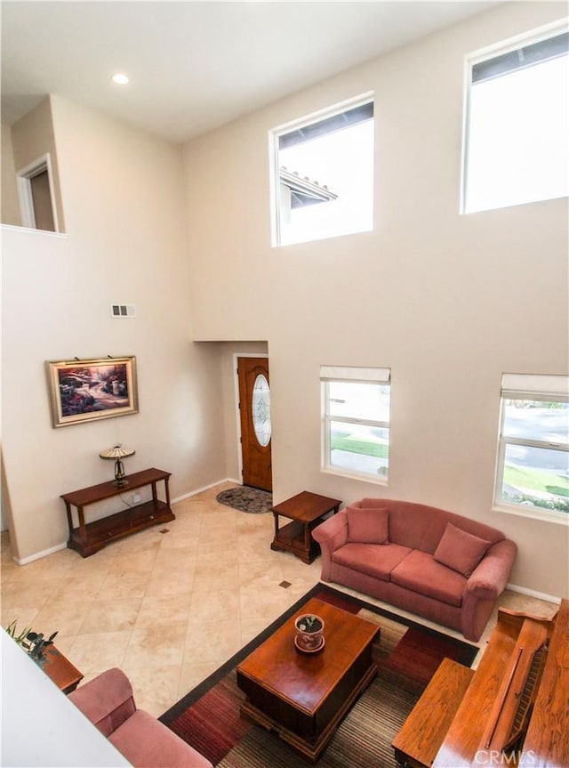 living room with a high ceiling