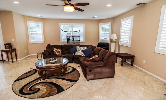 tiled living room featuring ceiling fan