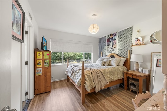 bedroom with wood-type flooring