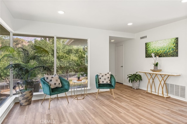 sitting room with light hardwood / wood-style flooring