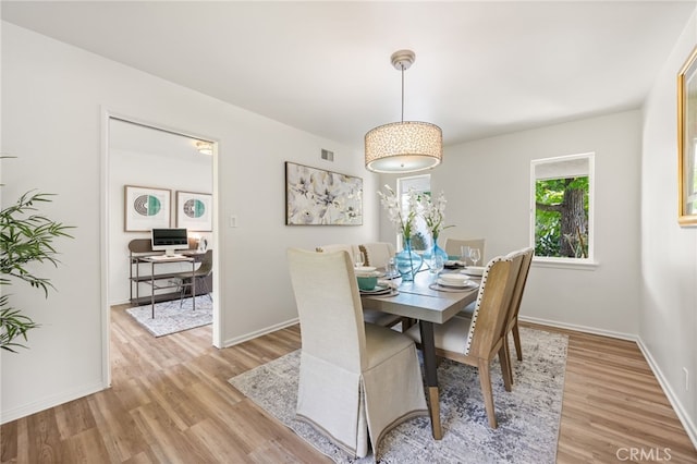 dining area with light wood-type flooring