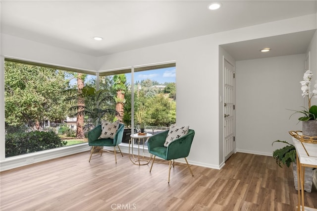 sitting room with hardwood / wood-style flooring