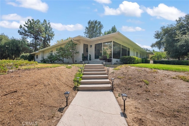 ranch-style house with a sunroom