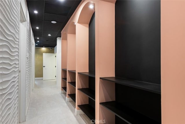 walk in closet with a paneled ceiling