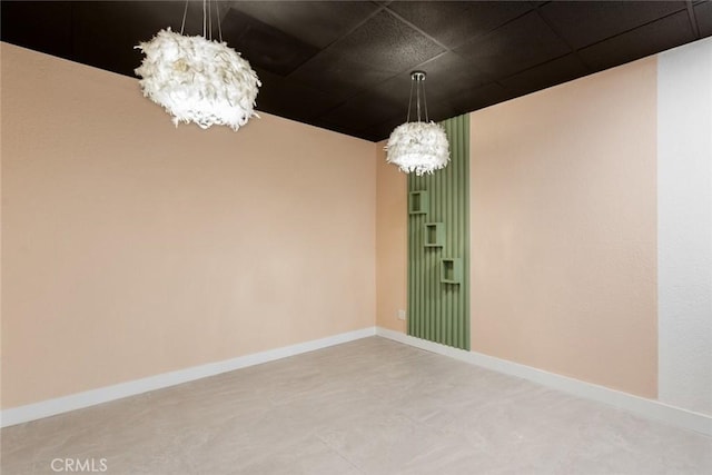 unfurnished dining area with a chandelier