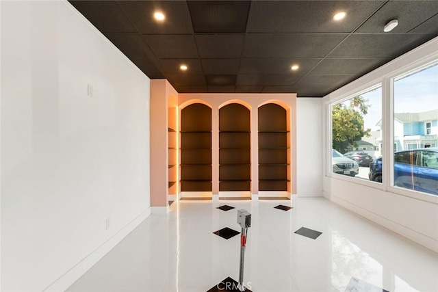 unfurnished room with a paneled ceiling