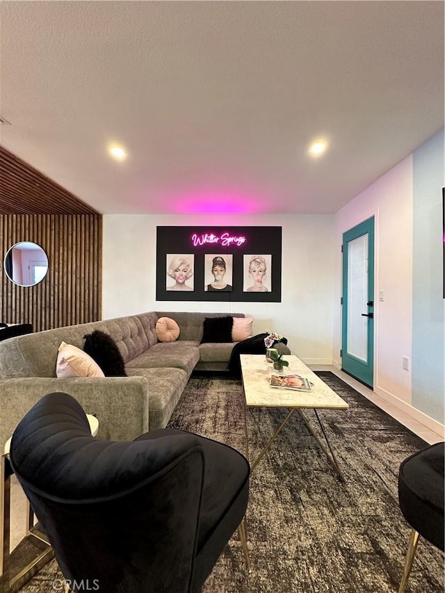 living room featuring carpet floors and a textured ceiling