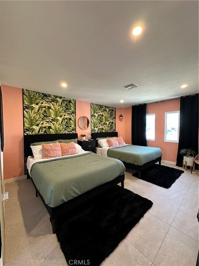 bedroom featuring light tile patterned flooring