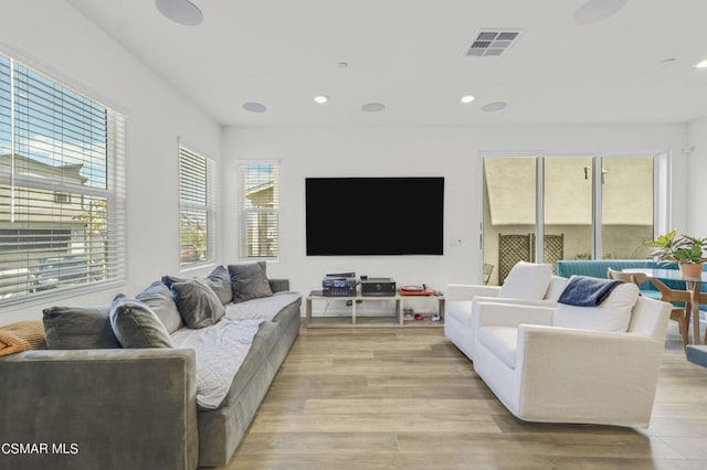 living room with light hardwood / wood-style floors