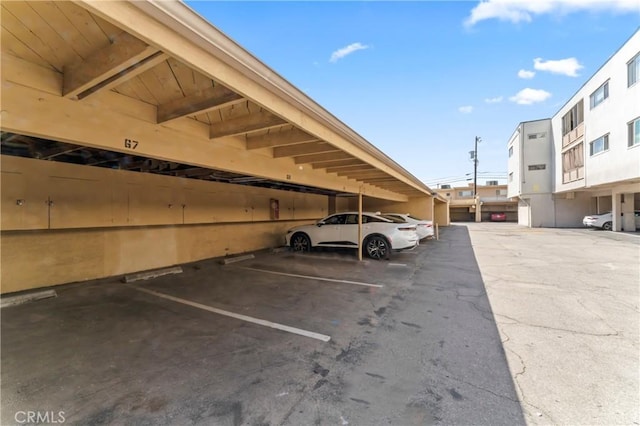 view of vehicle parking with a carport