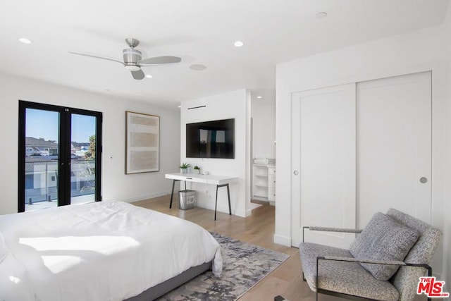 bedroom featuring a closet, access to exterior, light hardwood / wood-style flooring, ceiling fan, and french doors