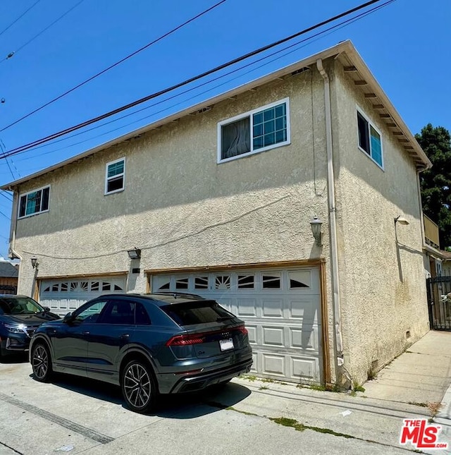 view of property exterior with a garage