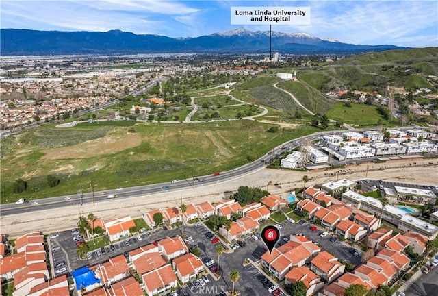 drone / aerial view featuring a mountain view