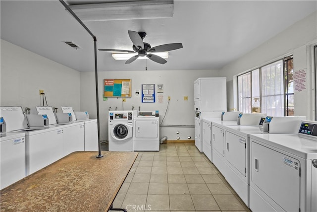 washroom with light tile patterned flooring, separate washer and dryer, and ceiling fan