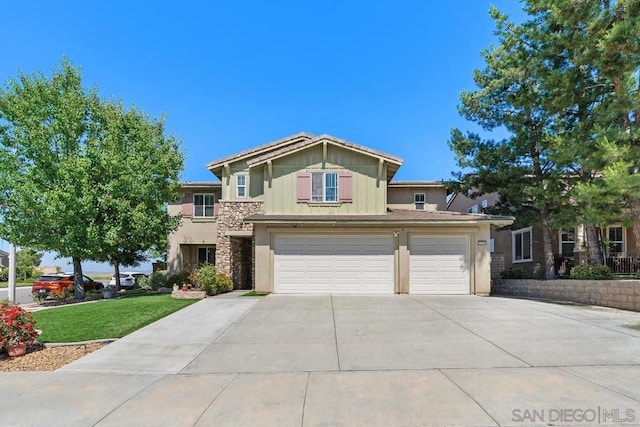 view of front of home with a garage and a front lawn