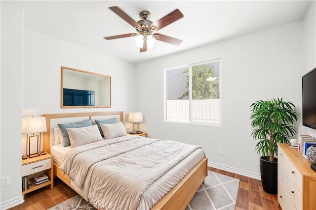 bedroom with ceiling fan and light wood-type flooring