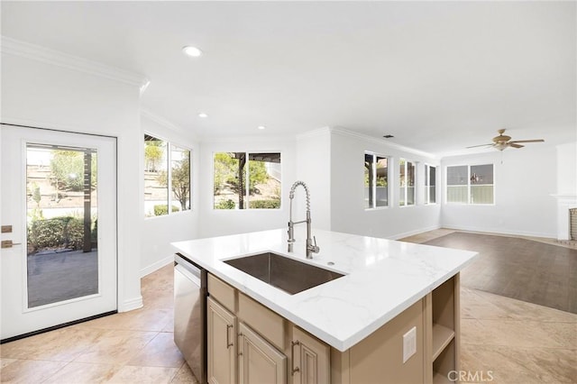 kitchen with sink, stainless steel dishwasher, crown molding, an island with sink, and light wood-type flooring