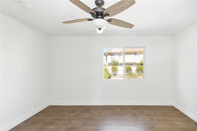 unfurnished room featuring ceiling fan and dark hardwood / wood-style flooring