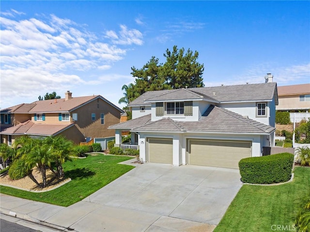 view of front facade featuring a front lawn and a garage