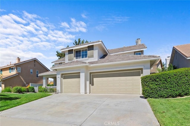 front facade with a garage and a front yard