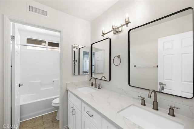 full bathroom featuring tile patterned flooring, vanity, toilet, and shower / bathtub combination