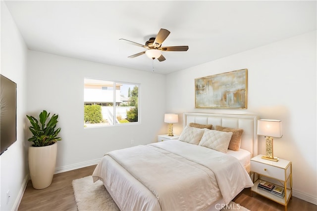 bedroom featuring hardwood / wood-style floors and ceiling fan