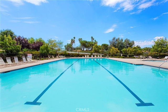 view of swimming pool with a patio area