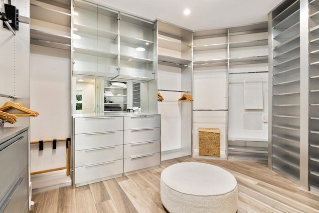 walk in closet featuring light hardwood / wood-style floors