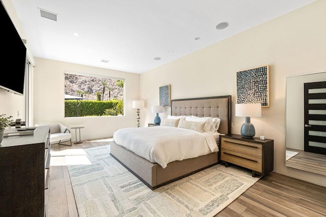 bedroom with light wood-type flooring