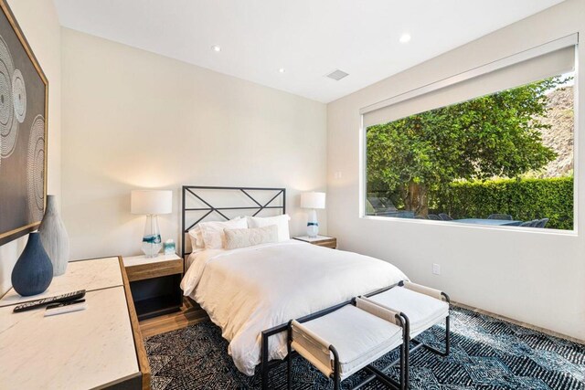 bedroom featuring dark hardwood / wood-style flooring