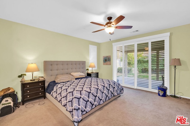 carpeted bedroom with access to outside and ceiling fan