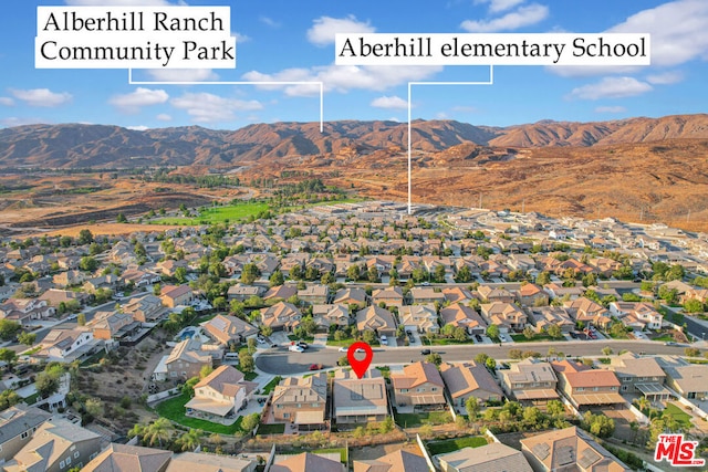 drone / aerial view featuring a mountain view