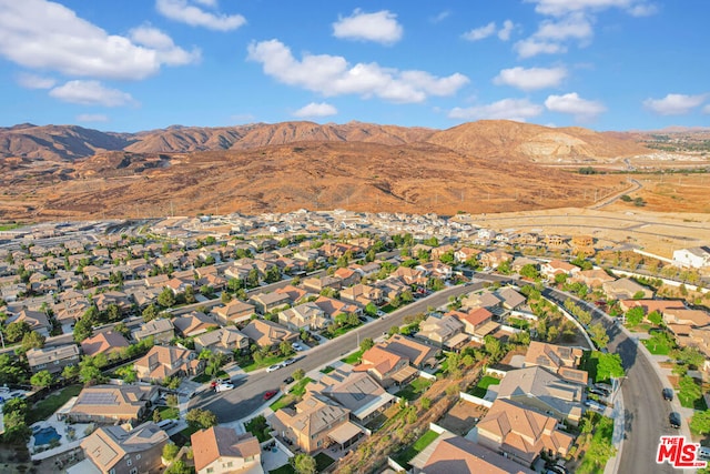 birds eye view of property featuring a mountain view