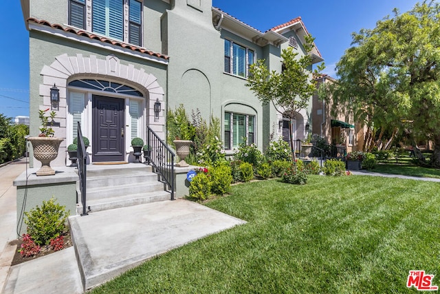 exterior space with a front lawn