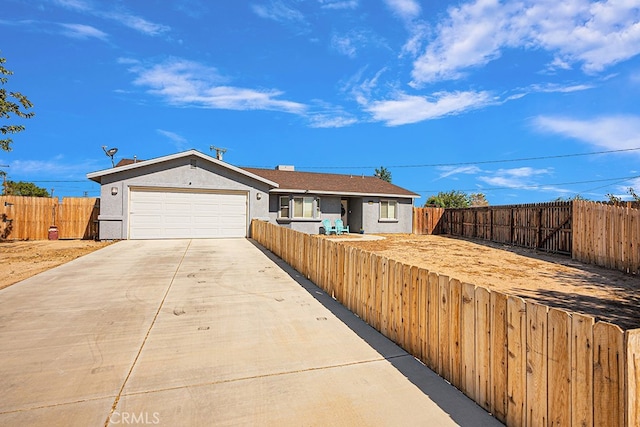 single story home with a garage