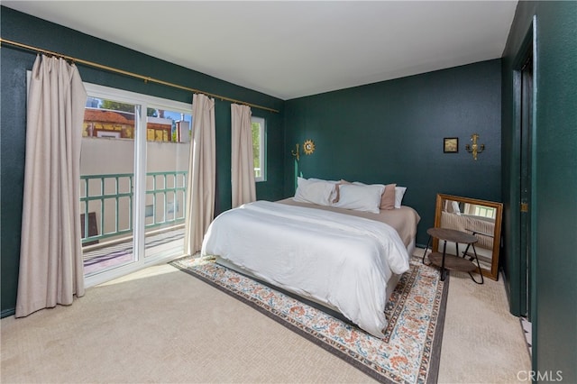 carpeted bedroom featuring multiple windows