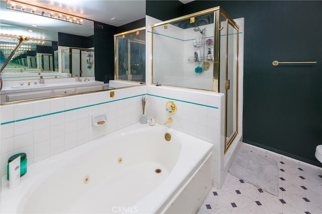 bathroom featuring shower with separate bathtub