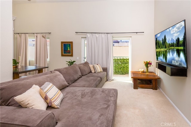 living room with light carpet and a wealth of natural light