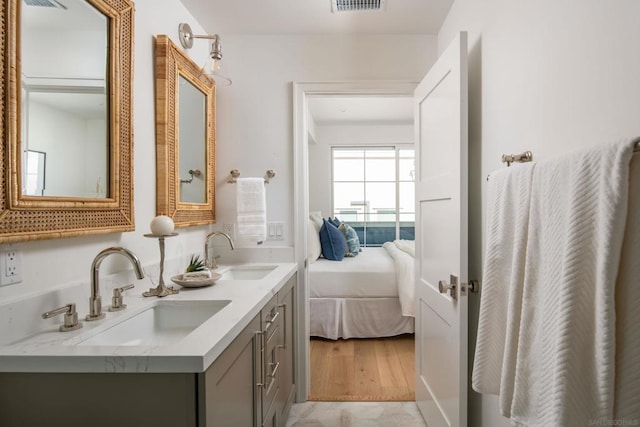 bathroom featuring hardwood / wood-style flooring and vanity