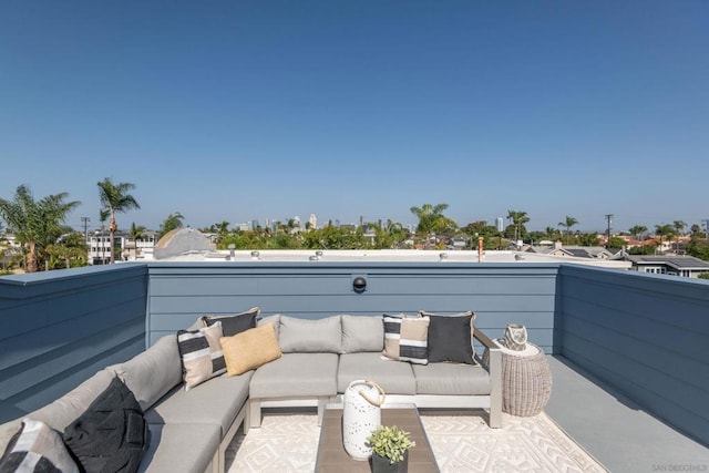 view of patio / terrace with an outdoor living space and a balcony